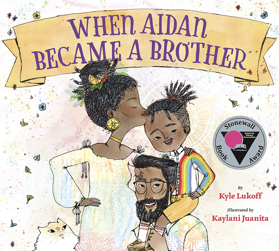 Cover of When Aidan Became A Brother, showing two Black parents and their son, holding each other close. The mother is pregnant with a large belly.