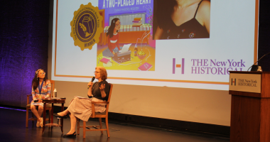 Author Doan Phuong Nguyen and DiMenna Children's History Museum Vice President & Director Alice Stevenson  sit on a stage in conversation about Doan Phuong's NY Historical Children's Book Prize winning title, A Two-Placed Heart.